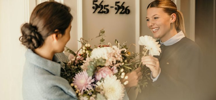 Accor hotel lobby with a frontline team member welcoming guests